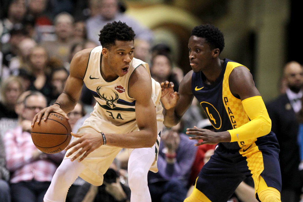 Giannis Antetokounmpo of the Milwaukee Bucks and Victor Oladipo of the Indiana Pacers