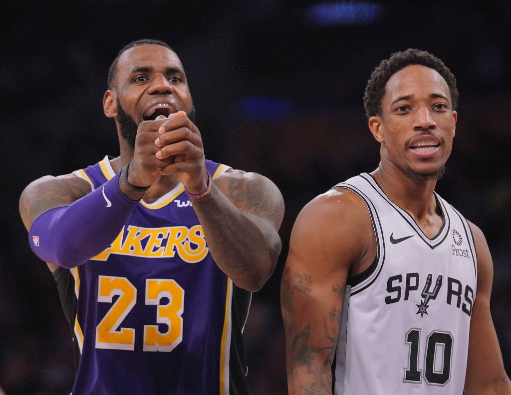 LeBron James of the Los Angeles Lakers and DeMar DeRozan of the San Antonio Spurs
