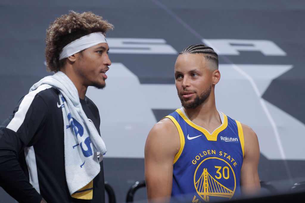 Steph Curry and Kelly Oubre of the Golden State Warriors