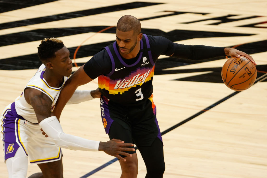 Chris Paul of the Suns and Dennis Schroder of the Lakers